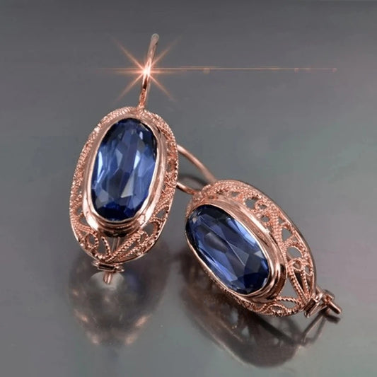 Златни дамски обеци със син сапфир