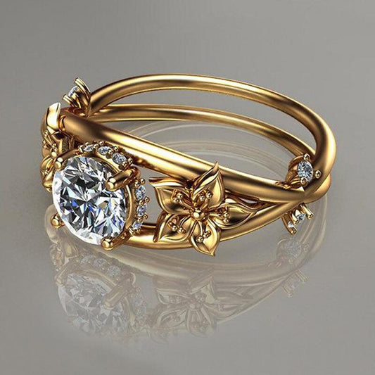 Златен дамски пръстен с цветя.
