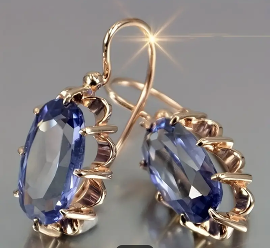 Златни дамски обеци със син сапфир